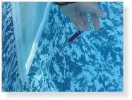 Dye drawn toward a hole in the liner, showing water escaping