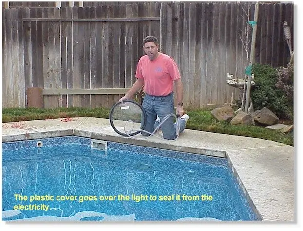 The plastic cover over the pool light; the caption on the photo says it seals the light from the electricity