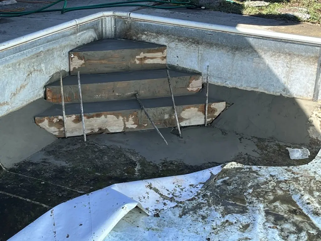 Project 1: concrete poured into the forms, three new steps taking shape