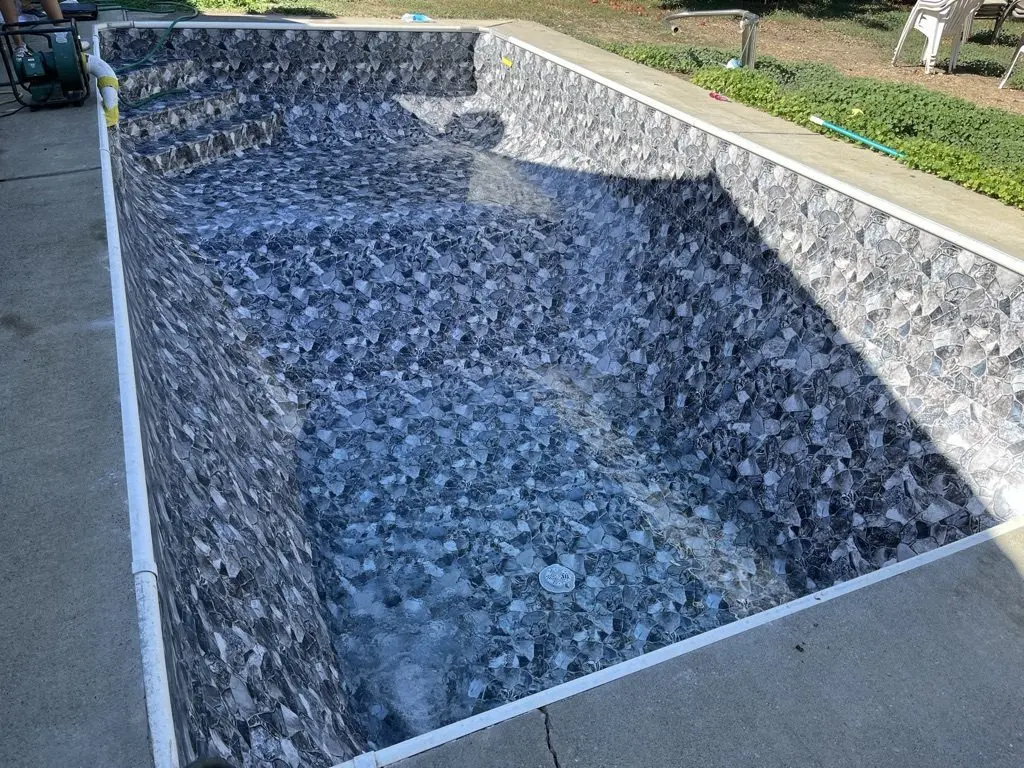 Project 1: the whole pool in its new stone-pattern liner, ready to fill