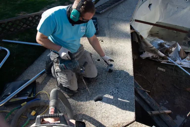 Drilling the deck for the new handrail anchors