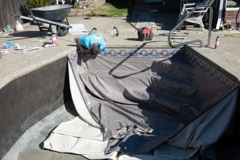 The new liner dropped into the pool, its tile border along the edge