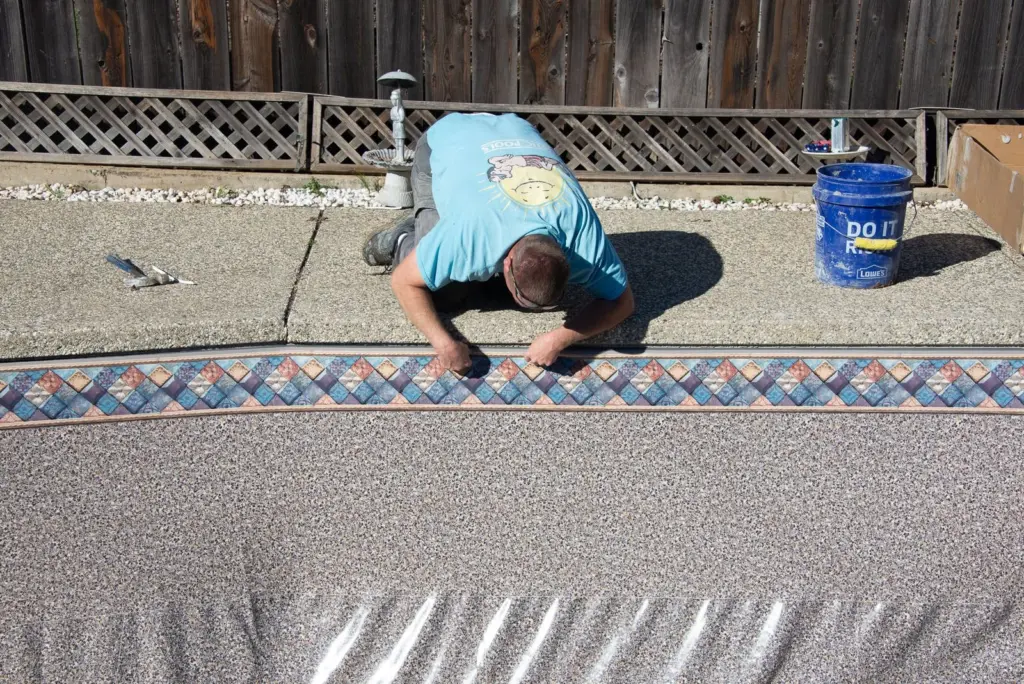 Setting the liner border straight along the coping