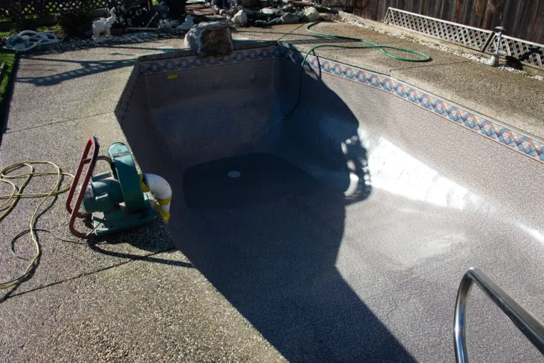 The finished liner in the empty pool, new steps at the shallow end