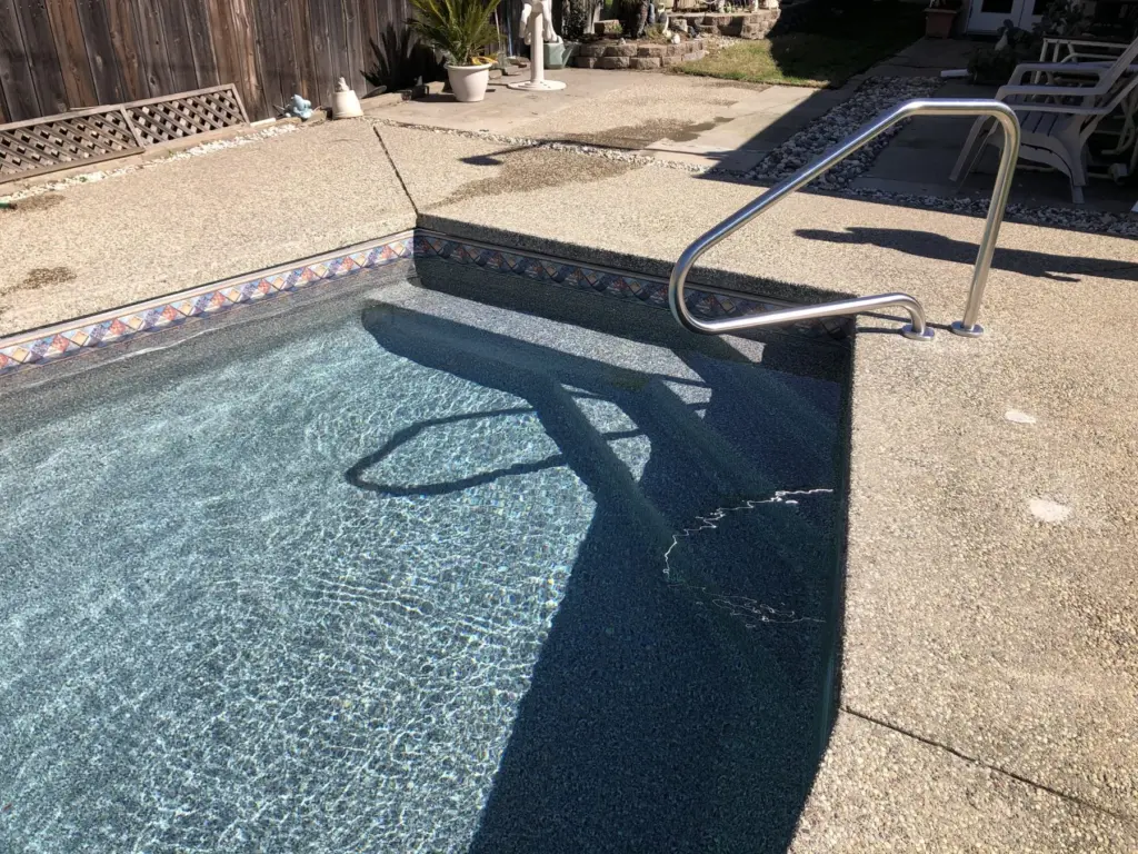 Filled: the new steps and handrail under clear water